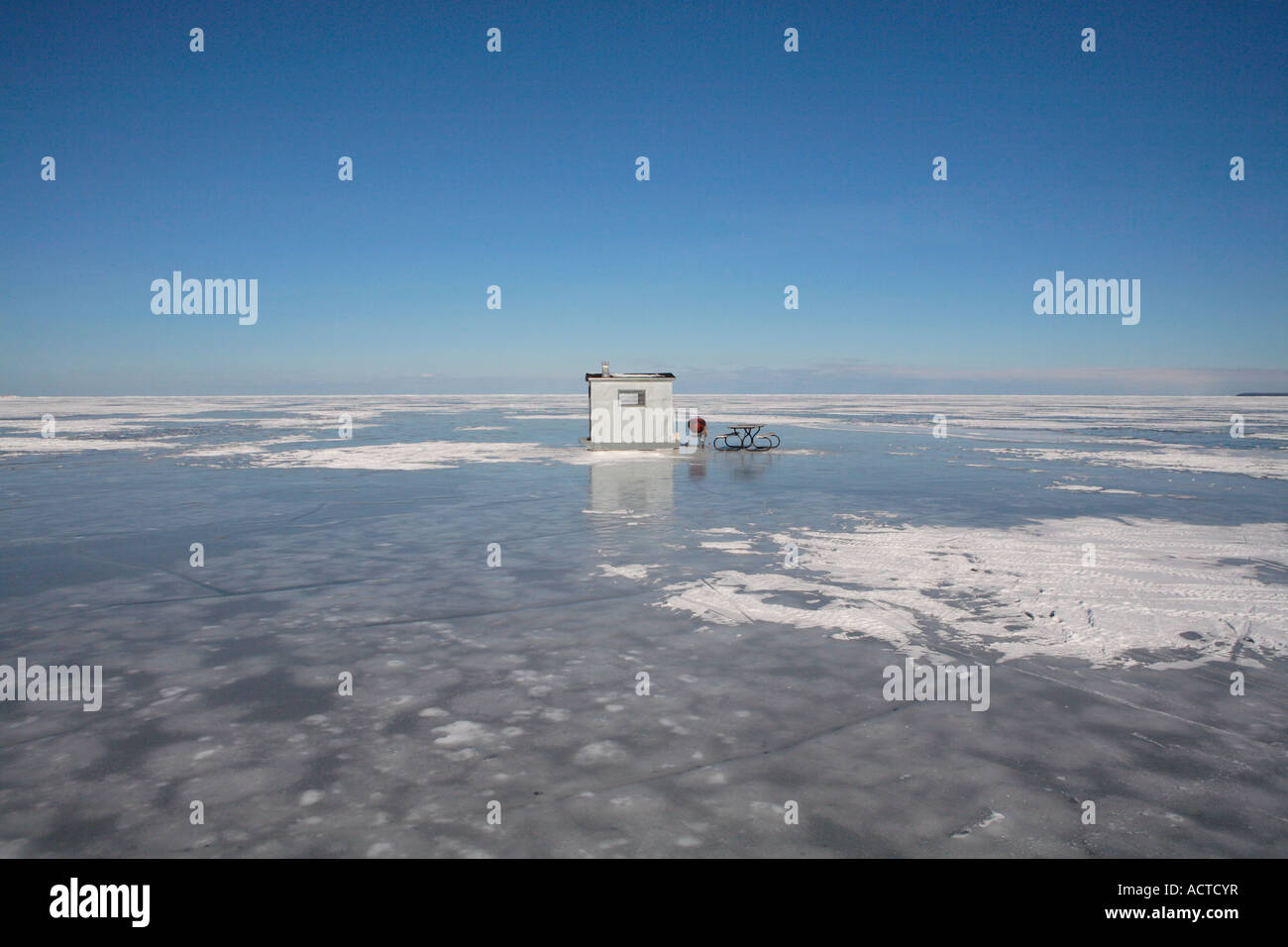 ice fishing shack the bench and the grill on the frozen lake michigan