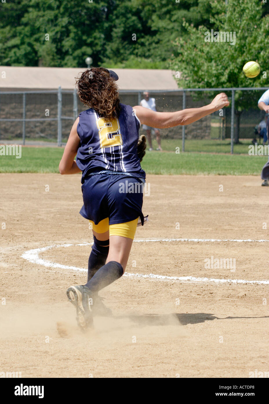 Softball third baseman throws to first Stock Photo Alamy