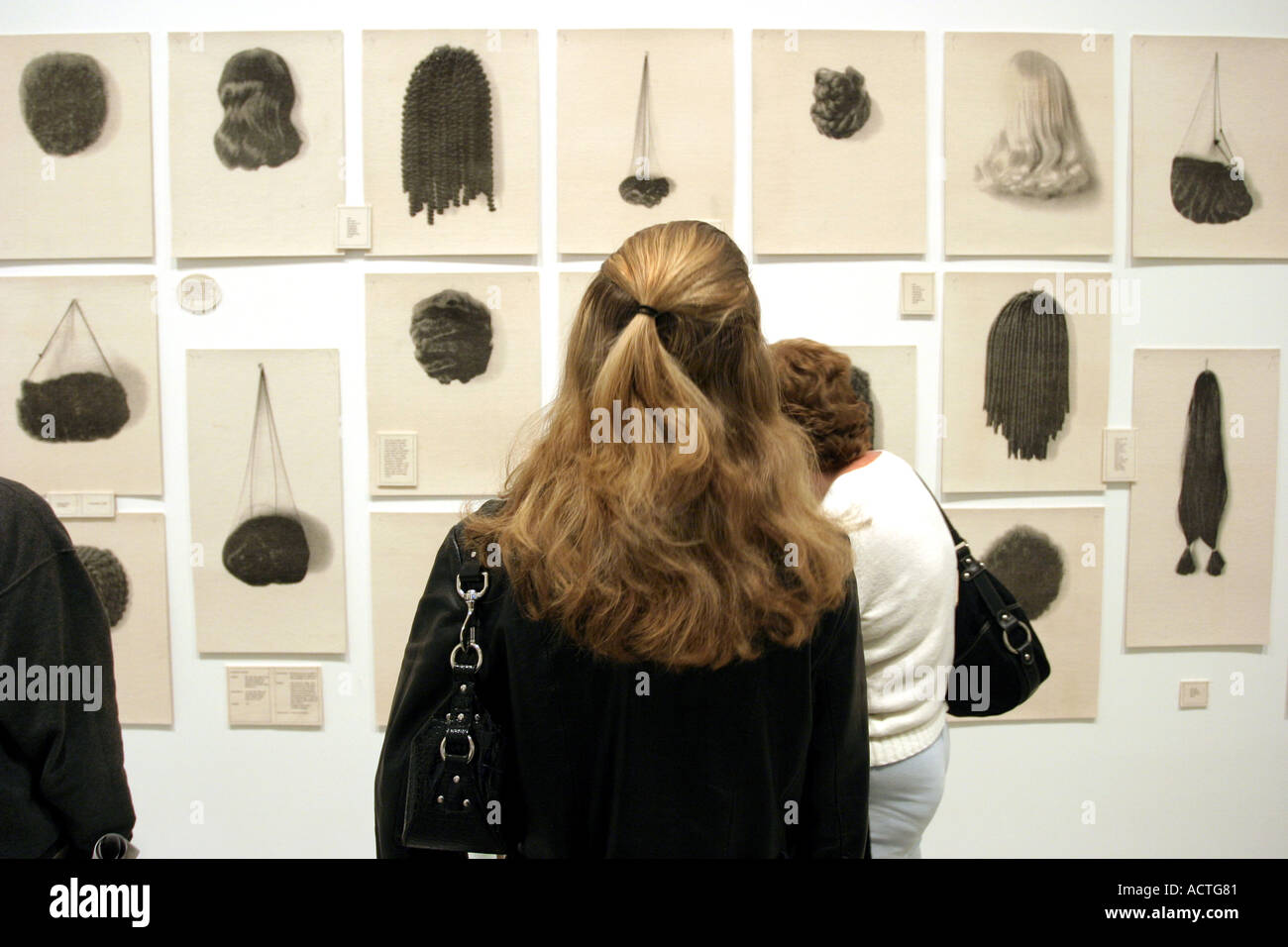 Visitor looking at hair sculpture in The Mueseum of Modern Art New York Stock Photo