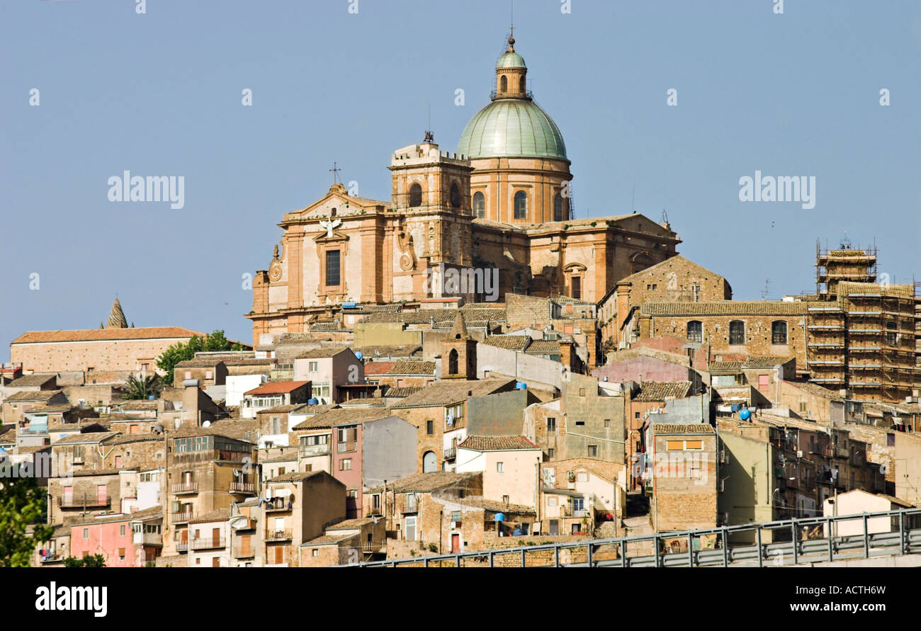 Cathedral Peak The massive domed Baroque Cathedral Duomo from 1768 and earlier bell tower dominates Piazza Armerina Sicily Stock Photo
