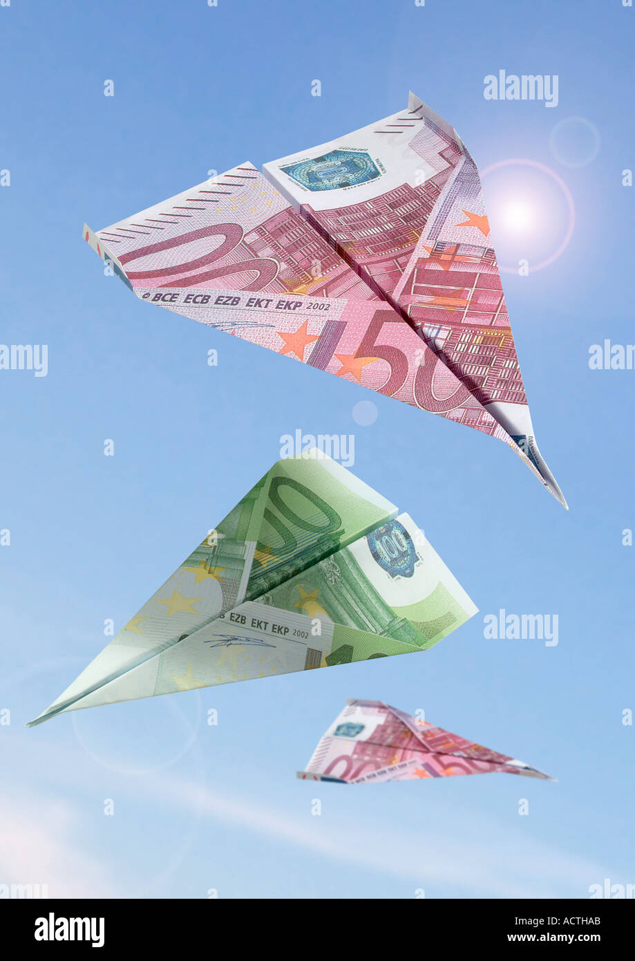 paperflier made from a euro bill Papierflugzeug aus Euroschein Stock Photo