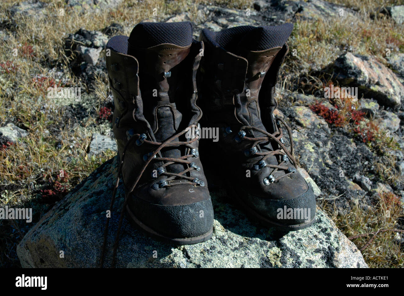 Worn out mountain boots on a rock Kharkhiraa Mongolian Altai near Ulaangom Uvs Aymag Mongolia Stock Photo