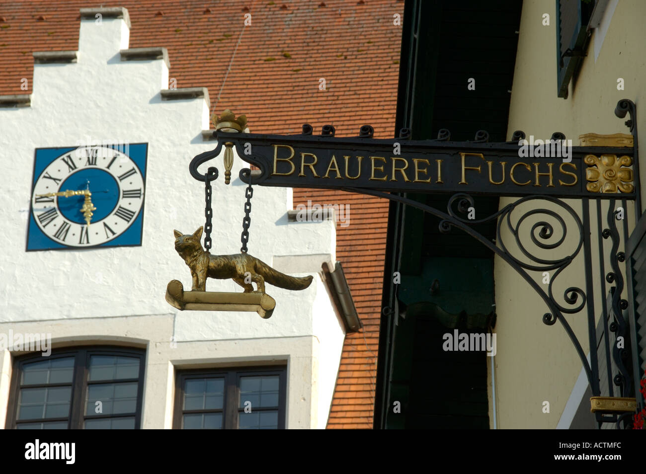 Old iron made restaurant sign Brauerei Fuchs in the city center with typical gable roofs Beilngries Altmuehltal Bavaria Germany Stock Photo