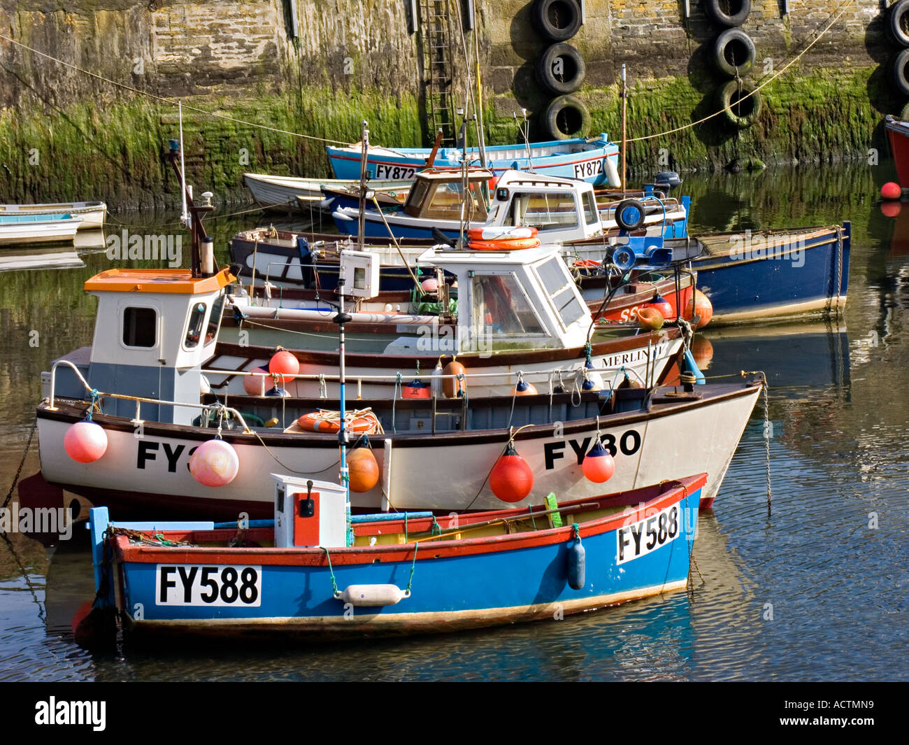 Colourful, moored small fishing boats. Falmouth, Cornwall, UK Stock Photo