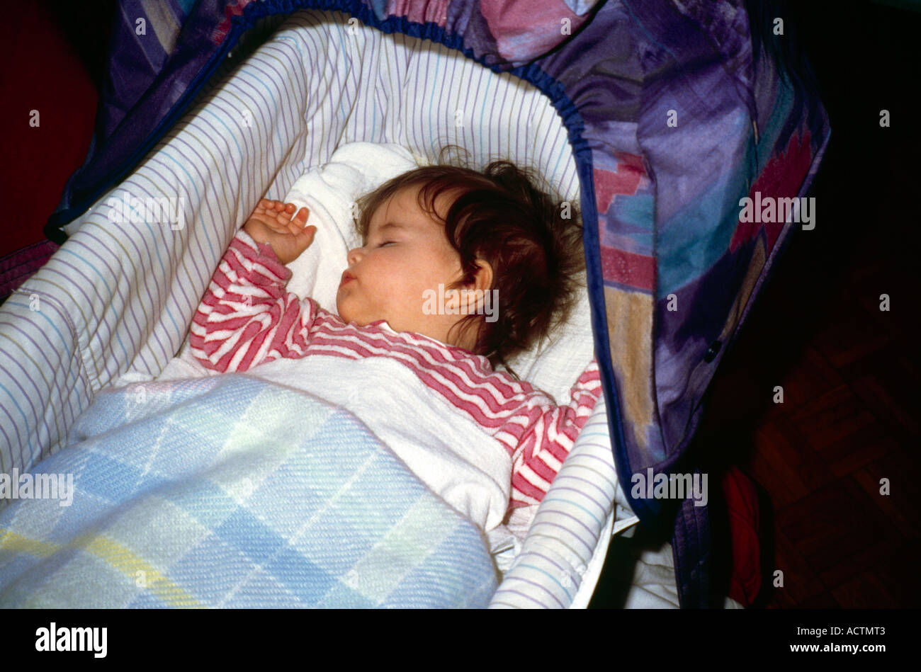 Baby girl sleeping in cot hi-res stock photography and images - Alamy