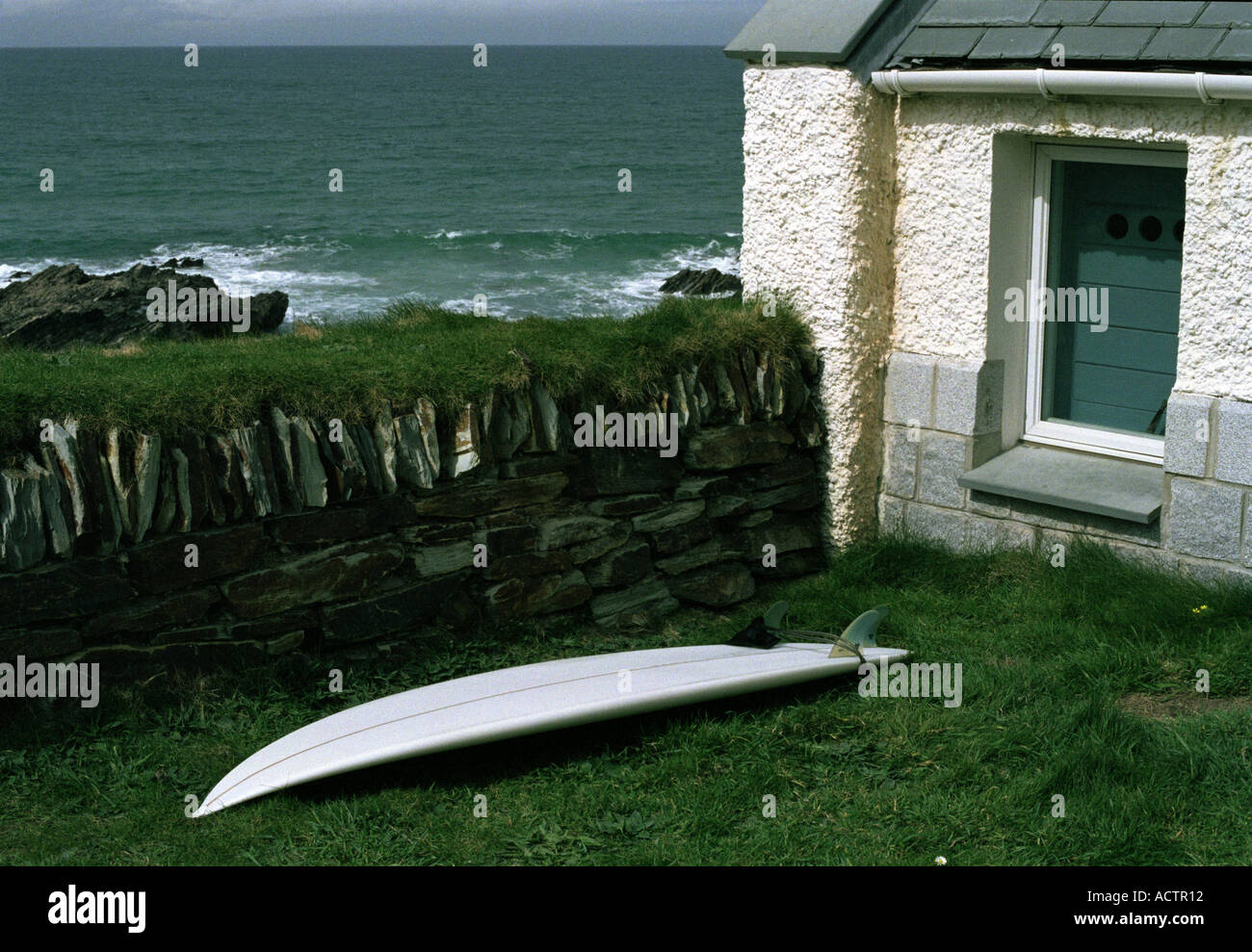 Surf Board Traditional Stone Wall And Cornish Cottage In A