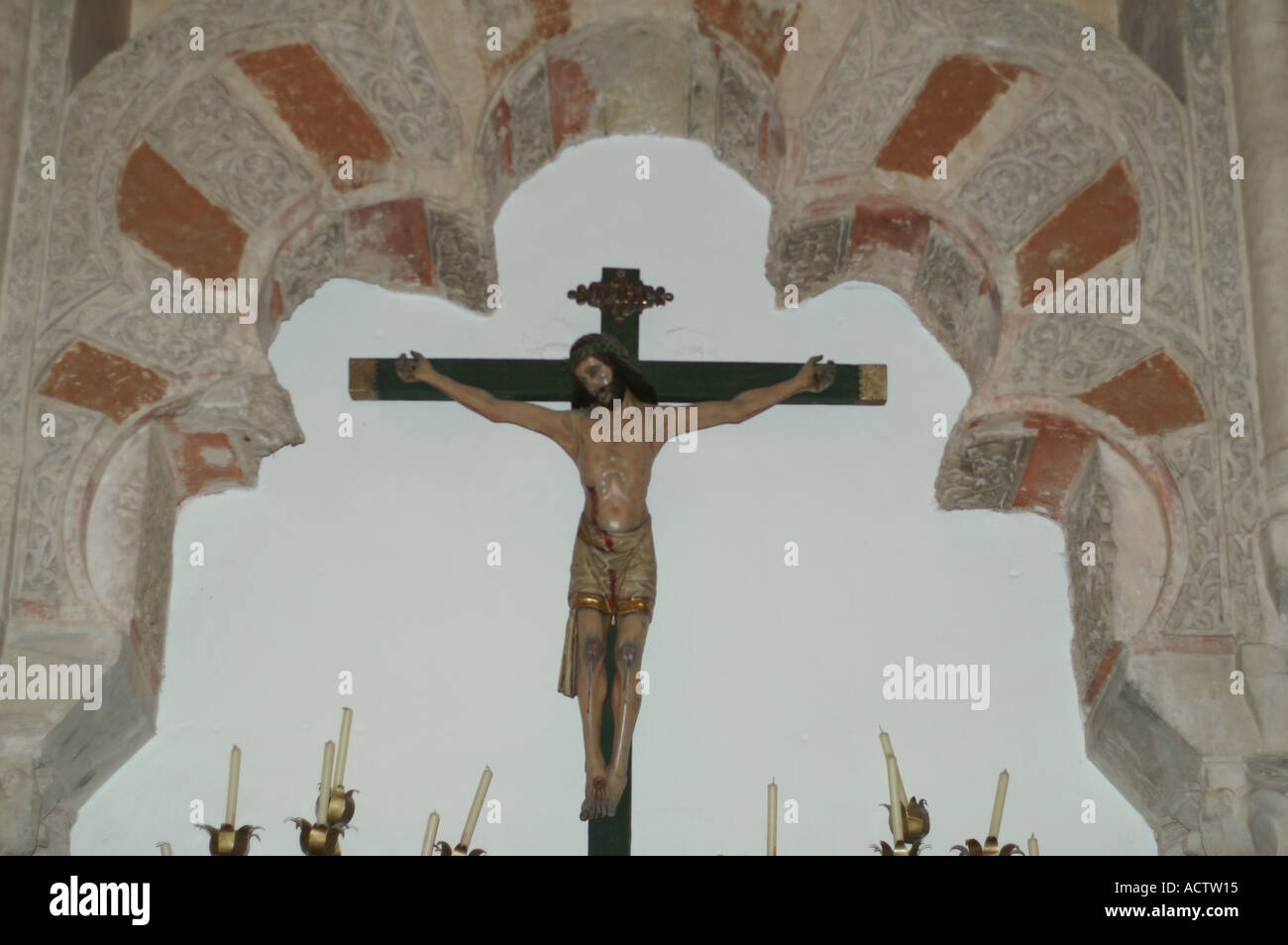 Cross and altar within moorish arch in Mezquita Cordoba Andalucia Spain Andalusia Espana España Stock Photo