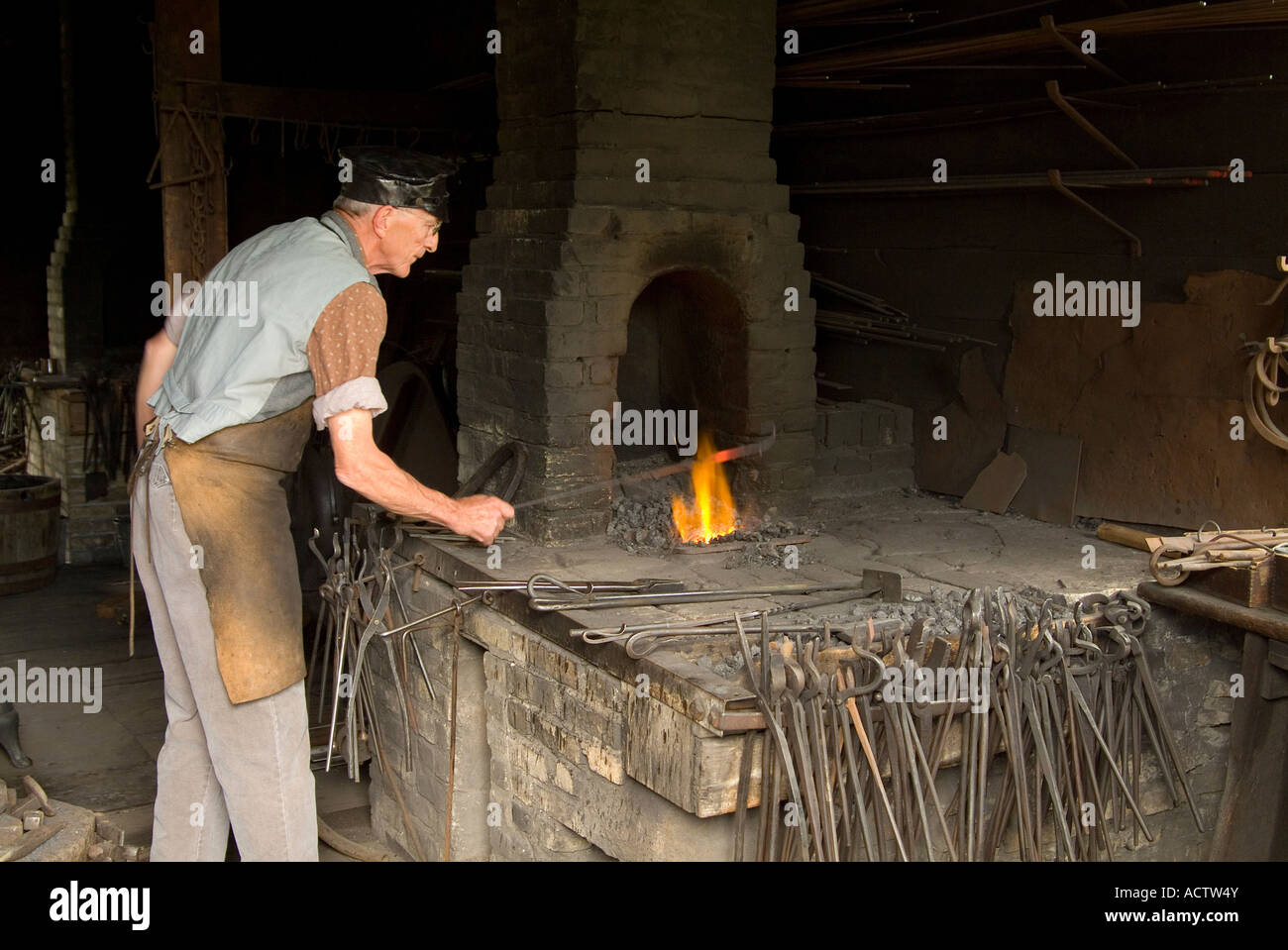 A BLACKSMITH AT WORK IN THE Stock Photo Alamy