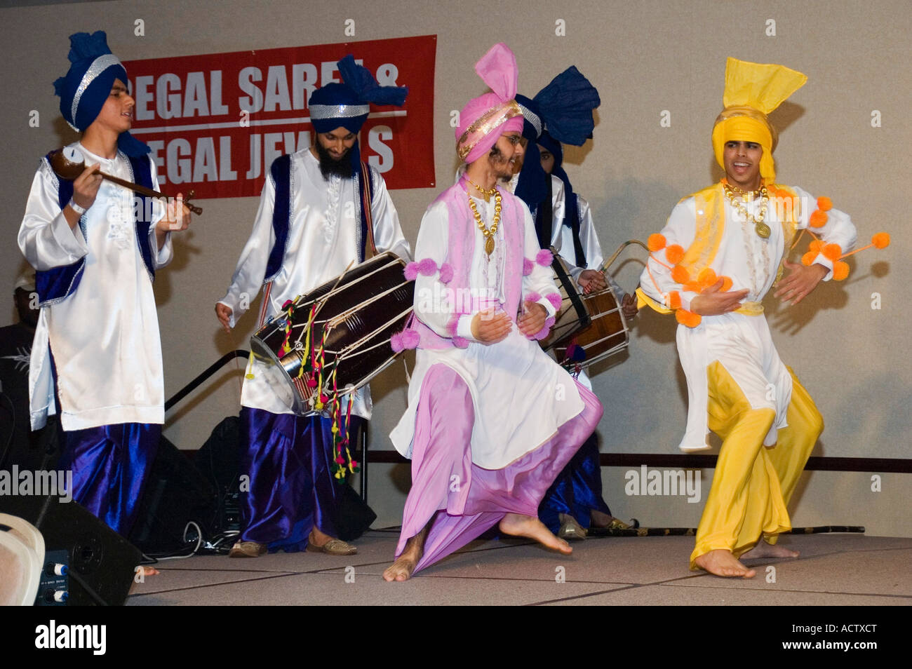 BHANGRA BEING PERFORMED BY MEN ON RYTHIM OF DHOL Stock Photo