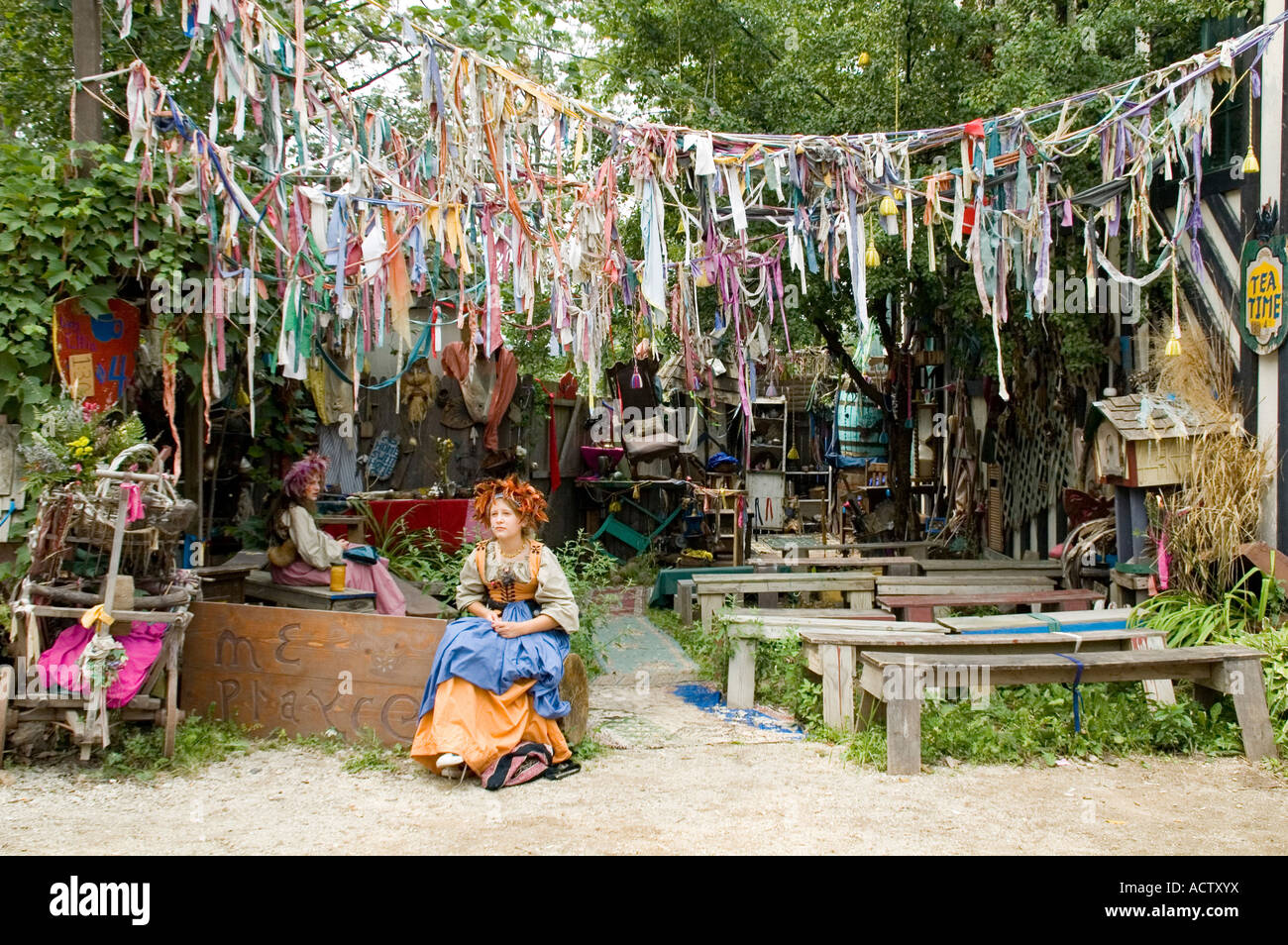 Two girls running a shop decorated with rags Stock Photo - Alamy