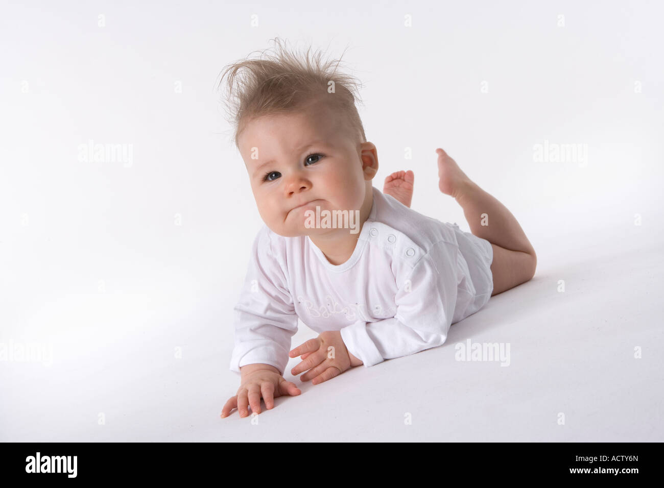 Charming baby lying on her belly Stock Photo