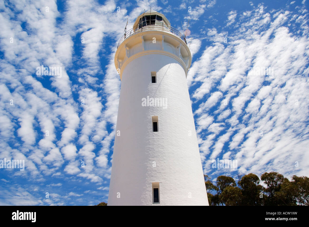 Australia Tasmania Wynyard Lighthouse on Table Cape with Mackerel Cloud Formations Stock Photo