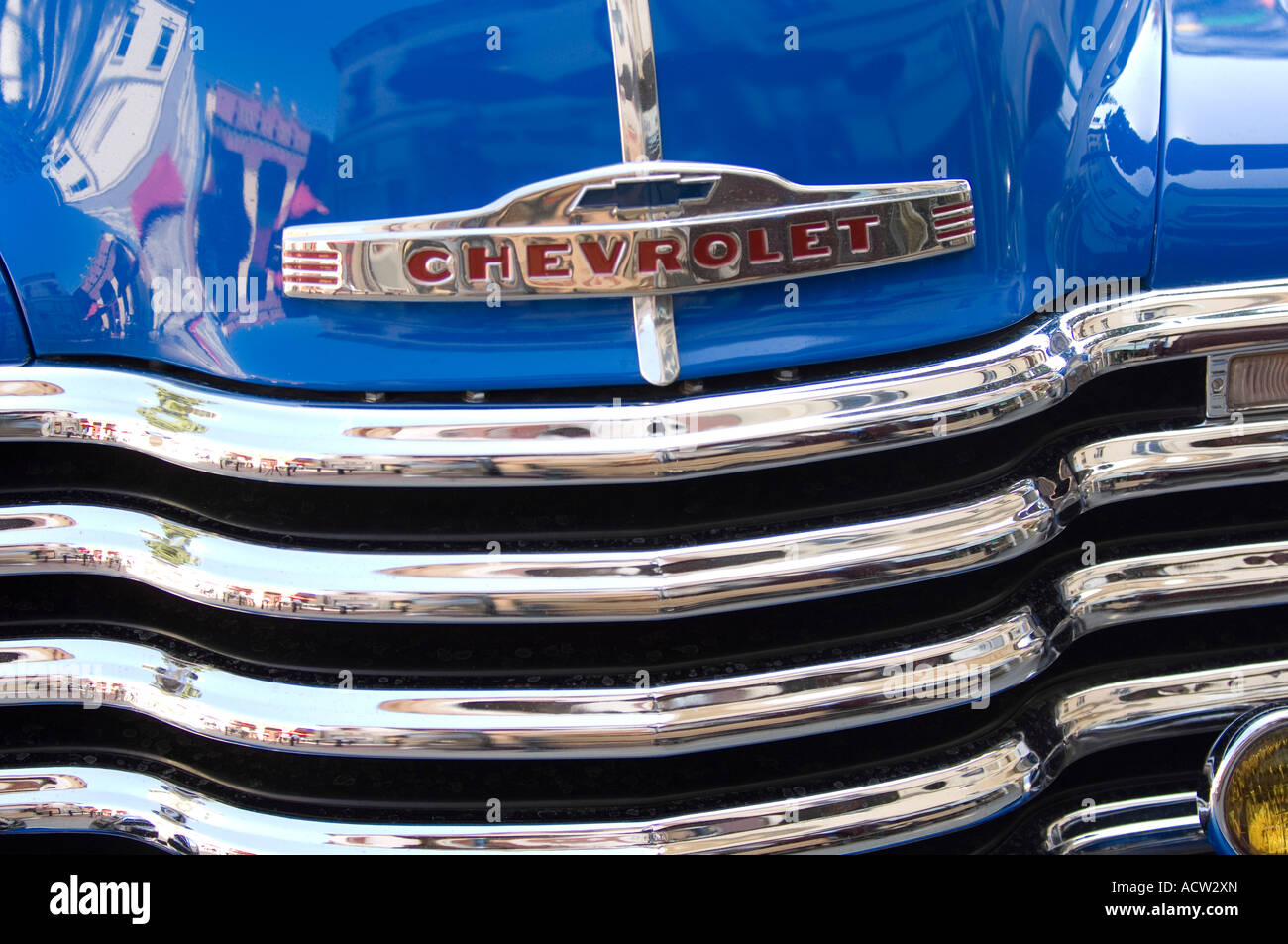 Front grille on a classic chrome and blue Chevrolet 3100 pickup truck. Stock Photo