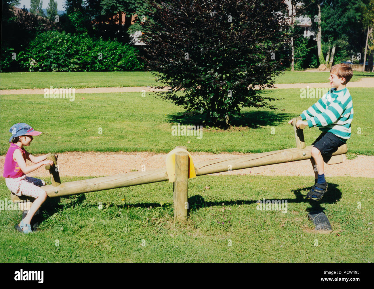 boy and girl in playground Stock Photo - Alamy