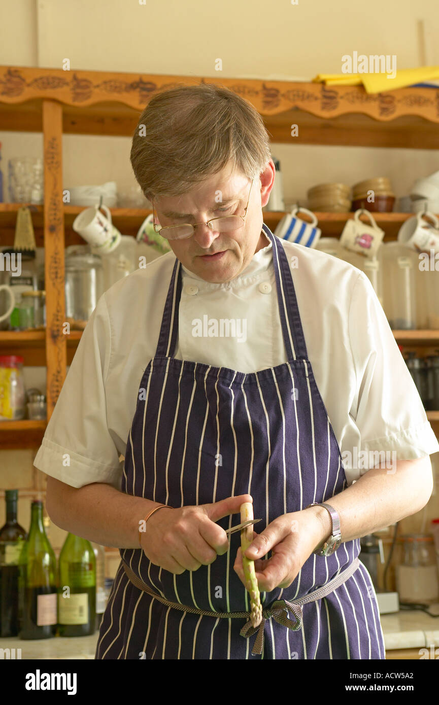 chef preparing food in country hotel kitchen Stock Photo Alamy