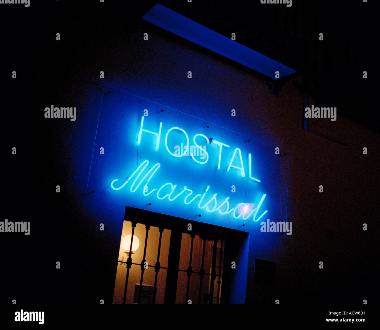 A blue illuminated sign for a Hostal a popular type of holiday accomodation especially for backpackers in Spain Stock Photo