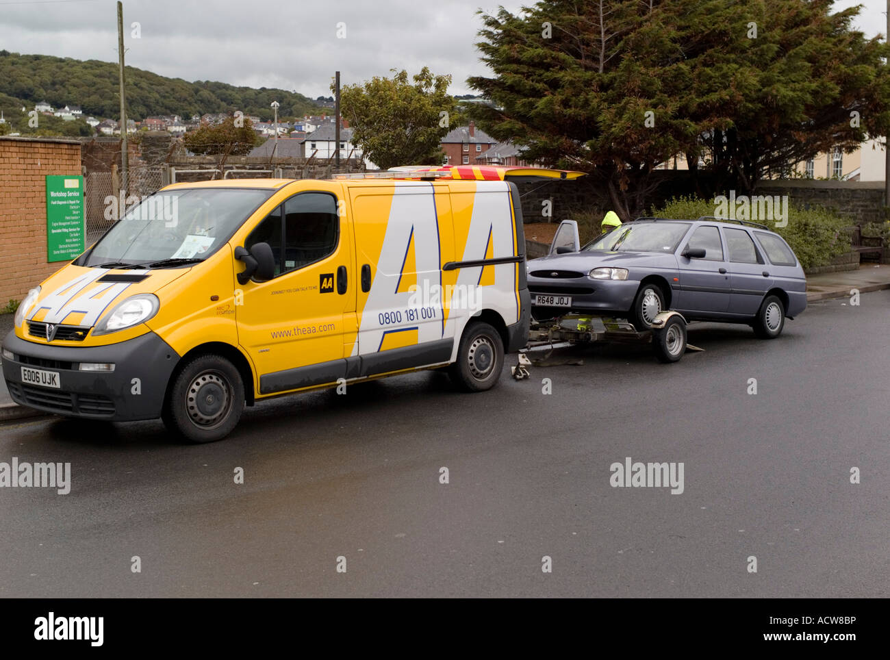 AA recovery vehicle towing estate car , UK Stock Photo