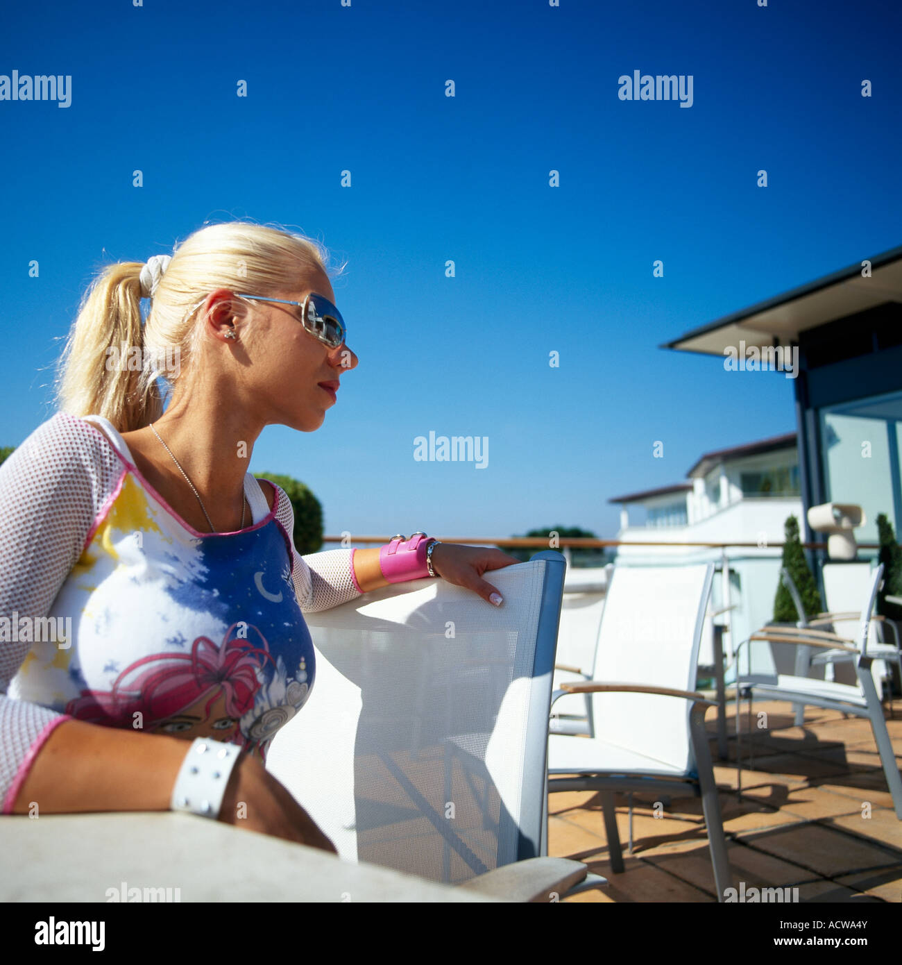 Young Woman Sitting Down Model Released Stock Photo - Alamy