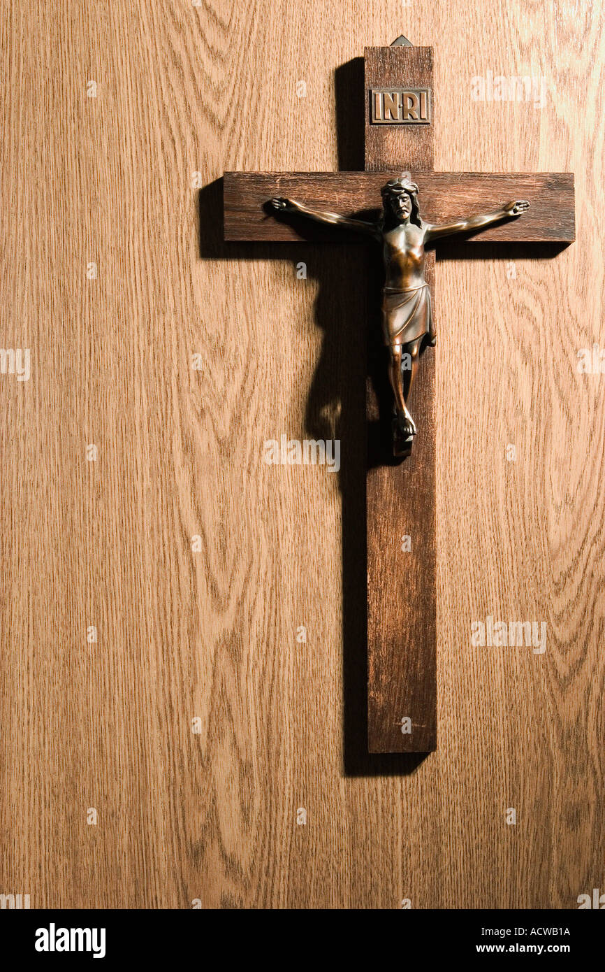 Crucifix on wall Stock Photo Alamy