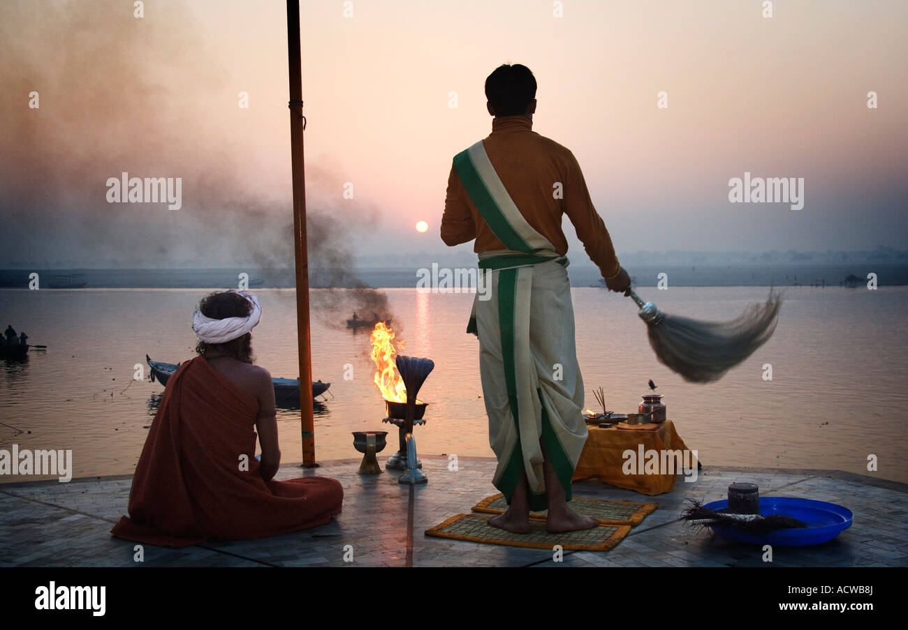 Hindi priest saluting the sun in the Ganges Varanasi Benares India Stock Photo