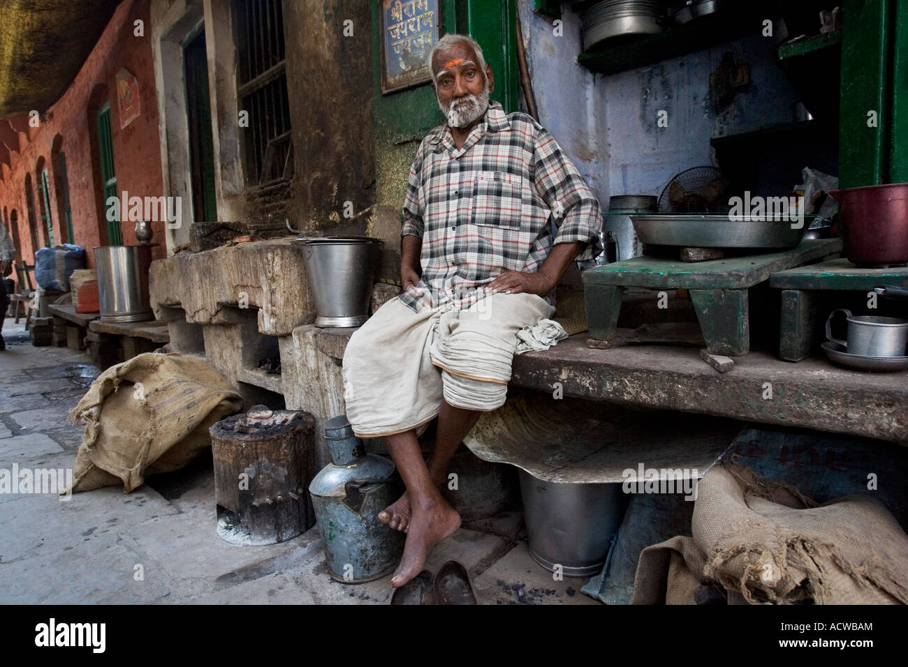Old food seller in his corner shop Varanasi Benares India Stock Photo