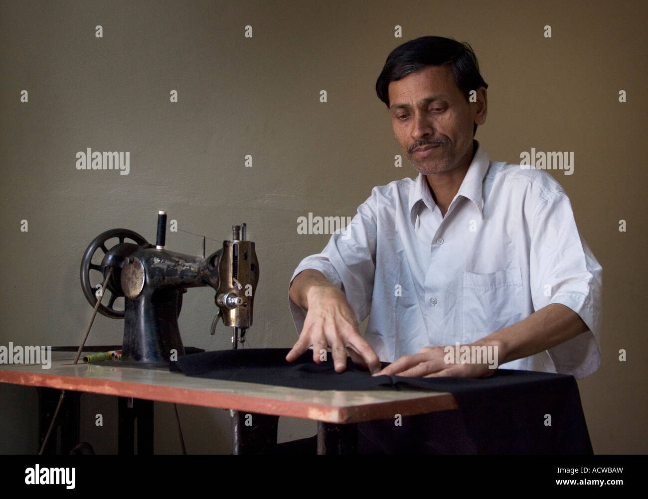 Tailor and old vintage sewing machine Varanasi Benares India Stock Photo