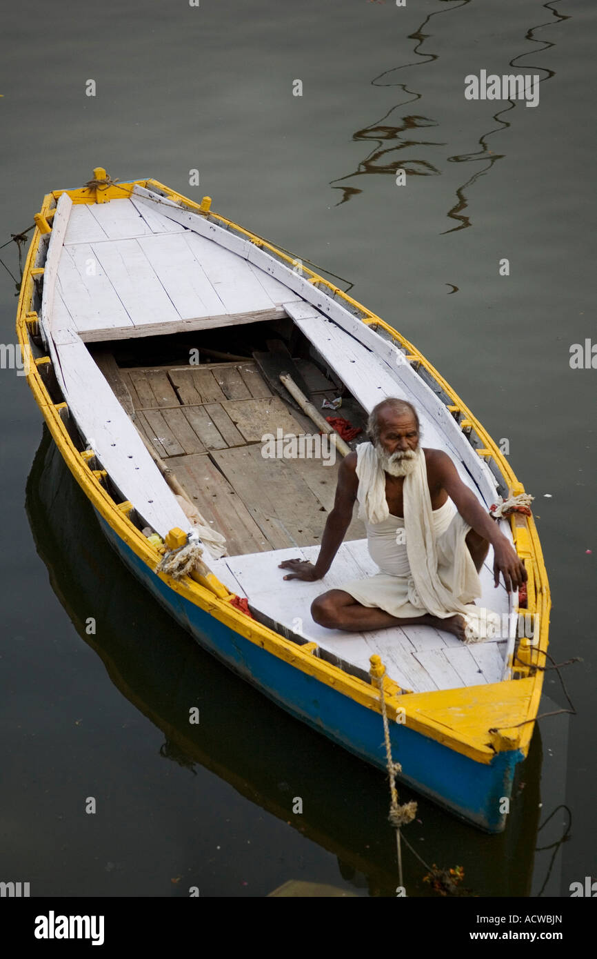 Boat and owner at relax Varanasi Benares India Stock Photo Alamy