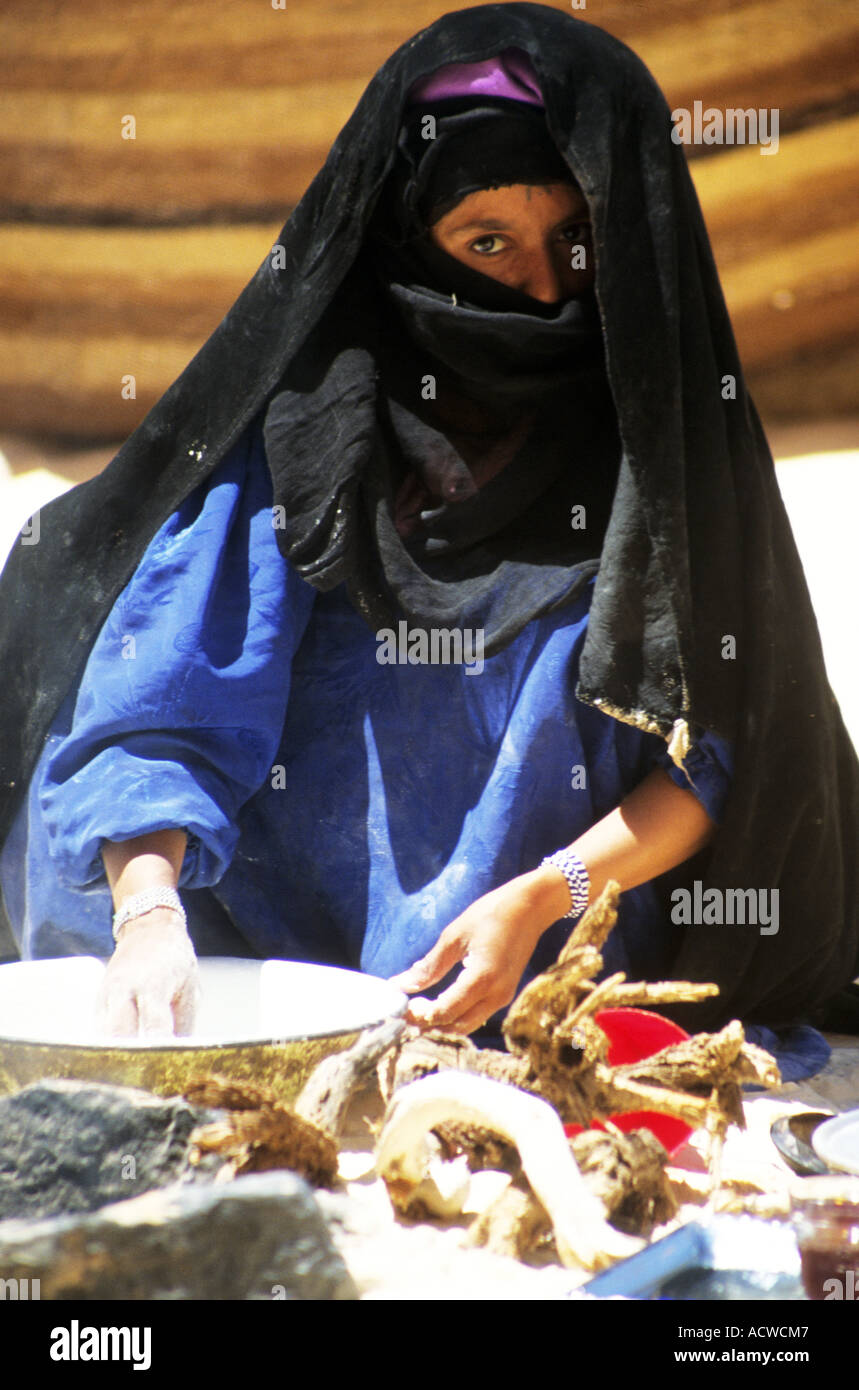 Woman cooking outside a Bedouin Tented camp site ,Jordon Stock Photo
