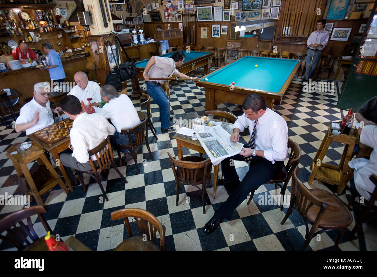 An everyday scene in a classic bar in Buenos Aires Argentina with billiards chess Stock Photo