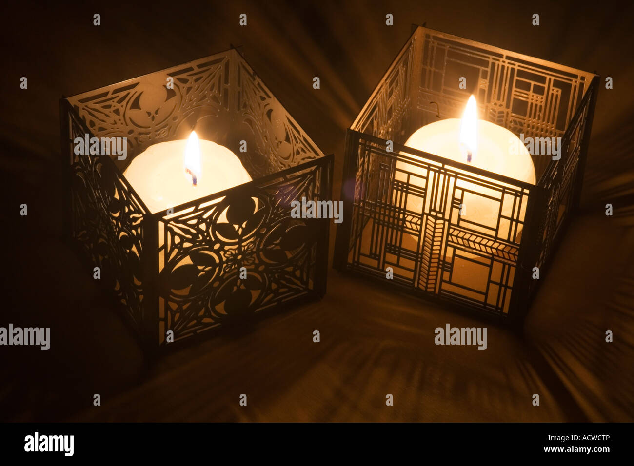 Two candles in Frank Lloyd Wright designed cases Stock Photo