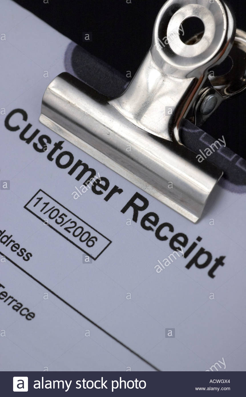 A customer receipt and bulldog clip Stock Photo