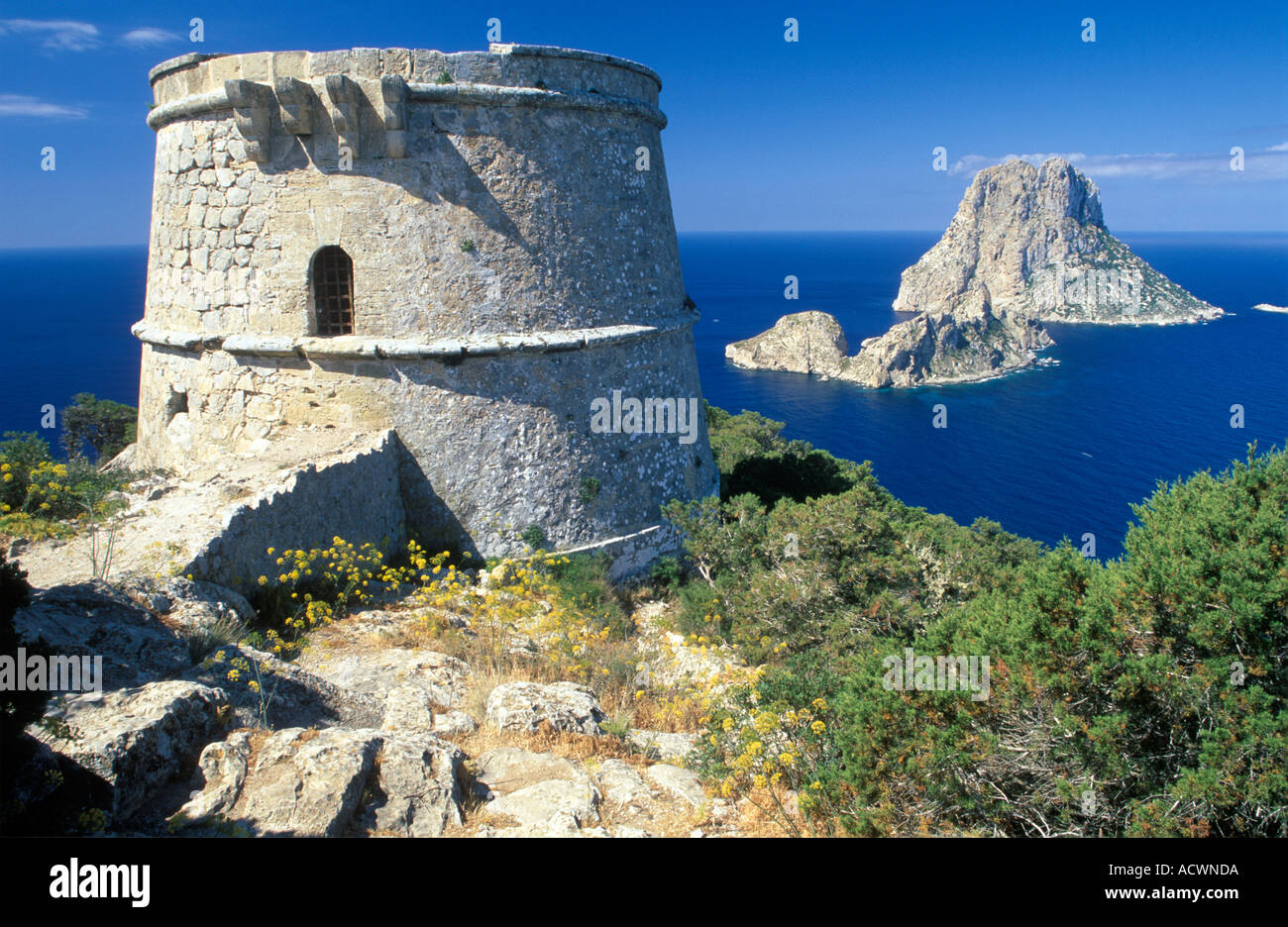 Ibiza southwest coast watchtower Torre des Savinar and Es Vedra island Stock Photo