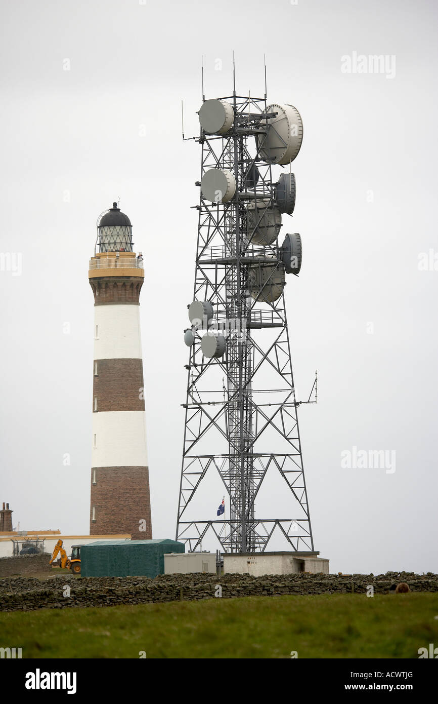 The new lighthouse built in 1854 42m high stands next to the telecommunication station North Ronaldsay Orkney Scotland UK Stock Photo