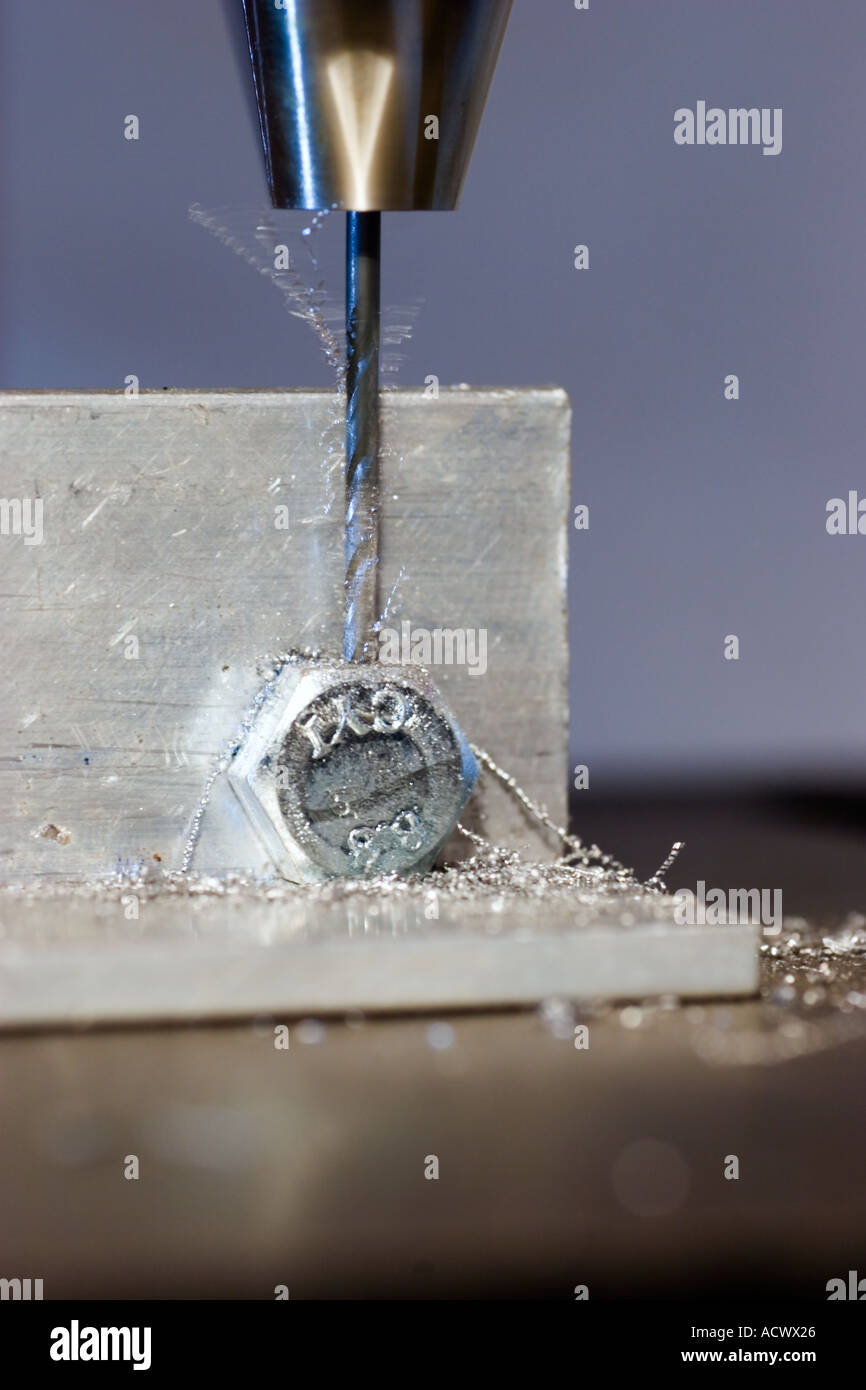 Drilling a bolt head for safety wire Stock Photo Alamy