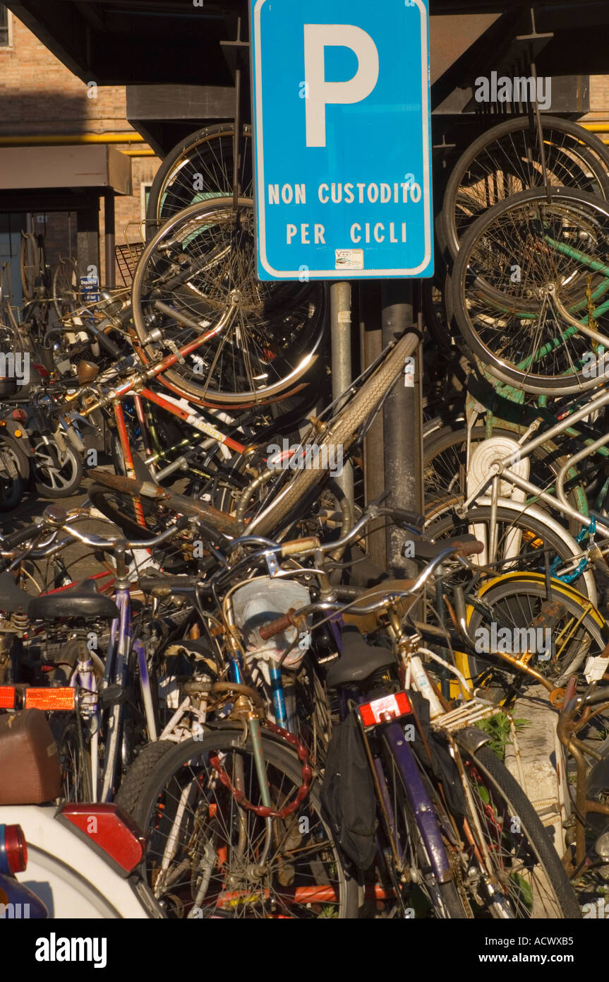 Color vertical image of a full bicycle parking area at the train staition in Bologna italy with