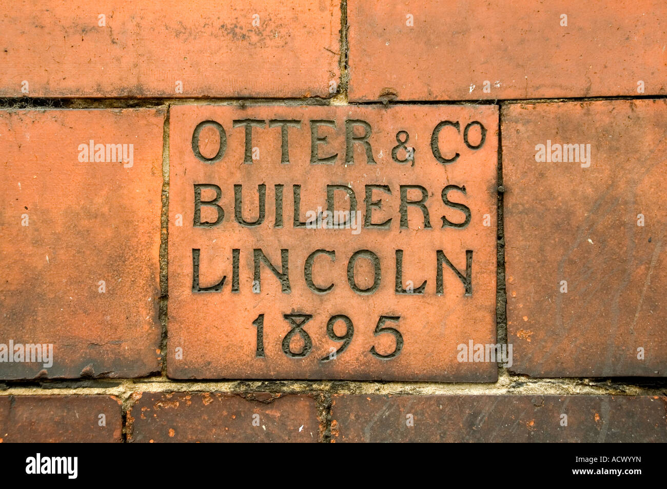 Otter and co, builders, Lincoln City, Lincolnshire, 1895, restoration, etched tile, dedicated stone, hidden named stone, old style script, Gothic tile Stock Photo