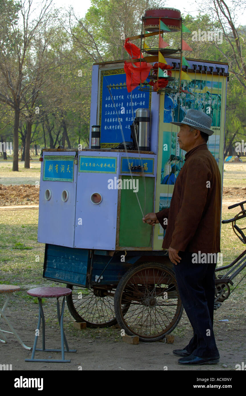 A man operating a peep show in the Imperial Summer Villa of Chengde Stock Photo