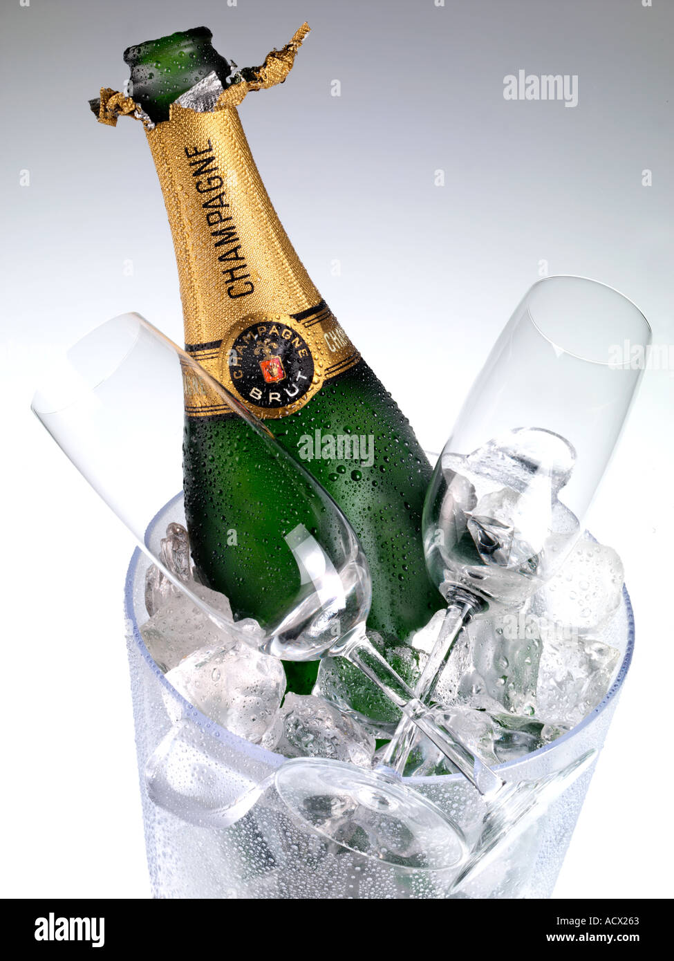 CHAMPAGNE ON ICE WITH BUCKET AND GLASSES Stock Photo