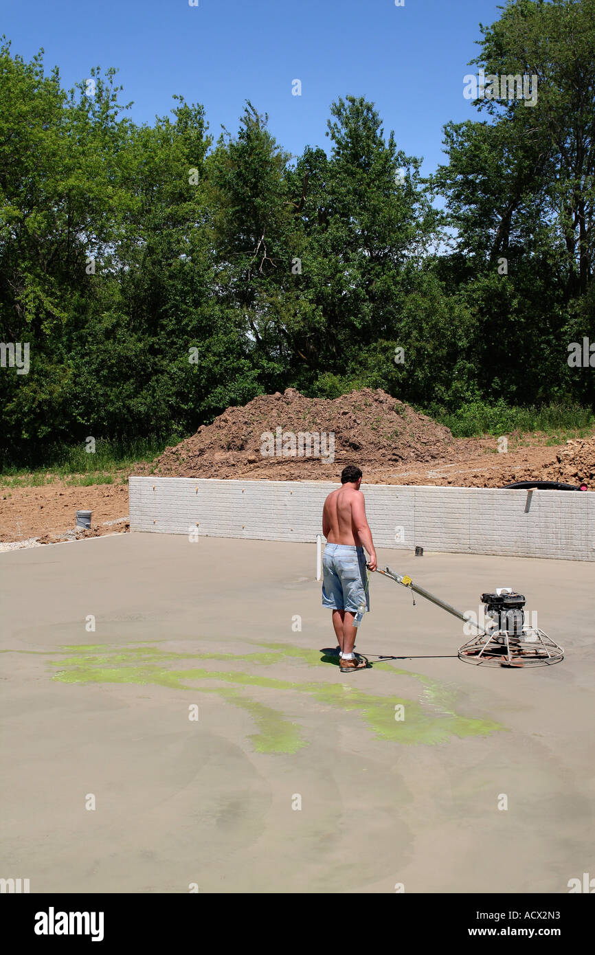 Cement power troweling Stock Photo Alamy