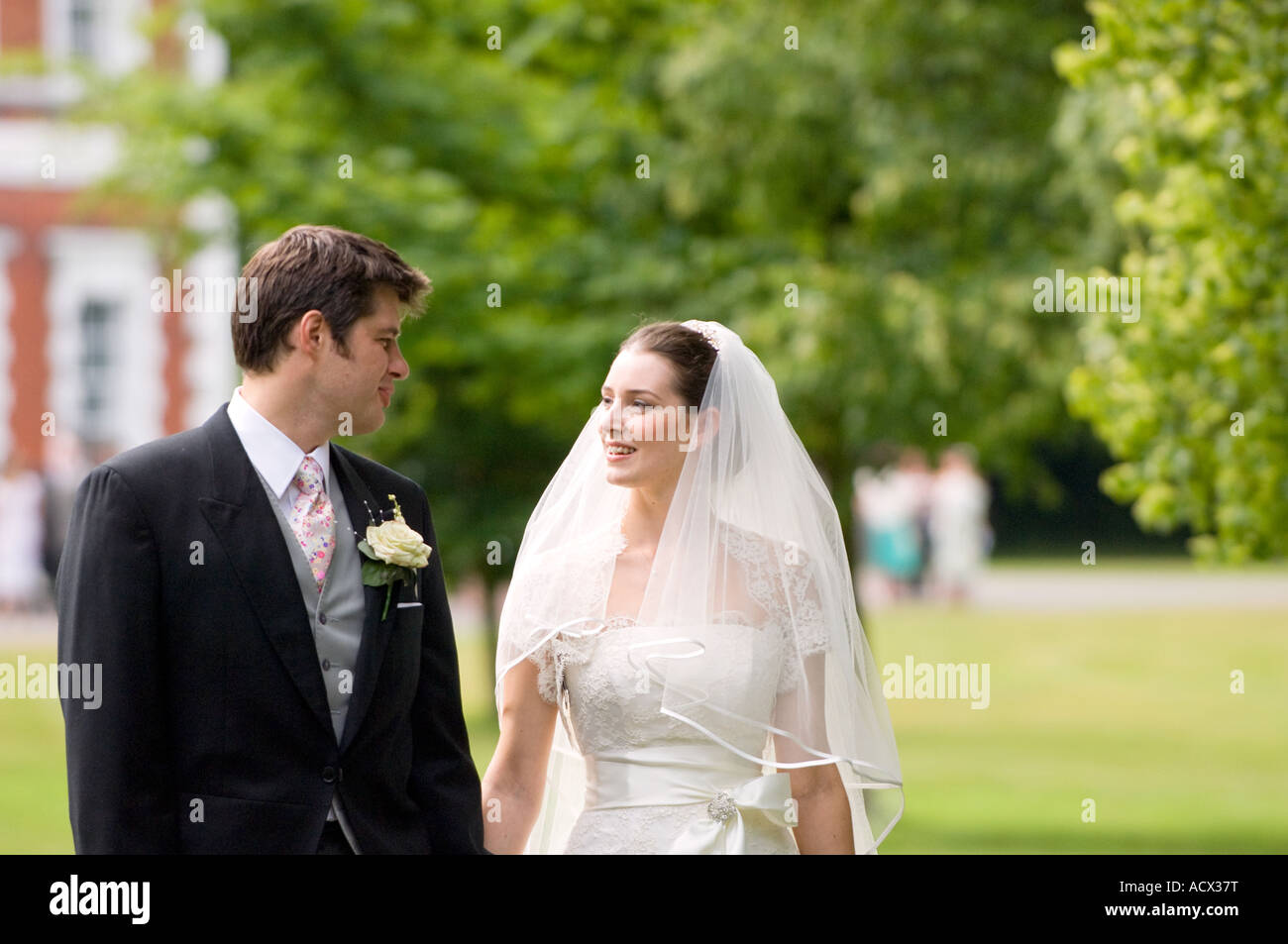 bride and groom walking hand in hand Stock Photo - Alamy
