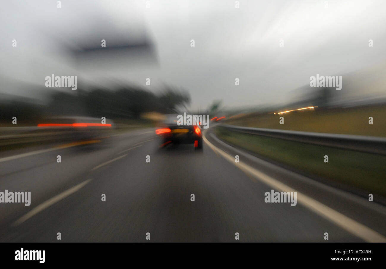 overtaking in wet weather conditions on a motorway, distorted view. Stock Photo