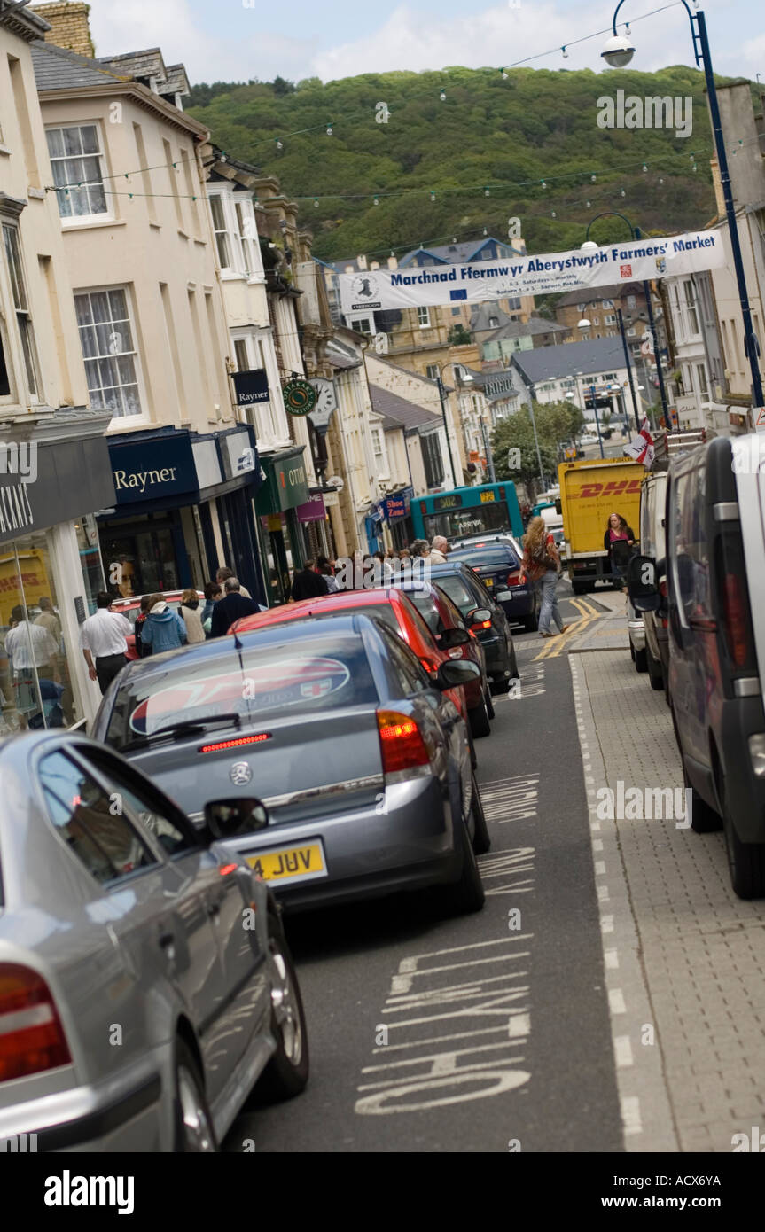 Heavy traffic in the main shopping street (Great Darkgate Street) Aberystwyth town centre, Wales Stock Photo