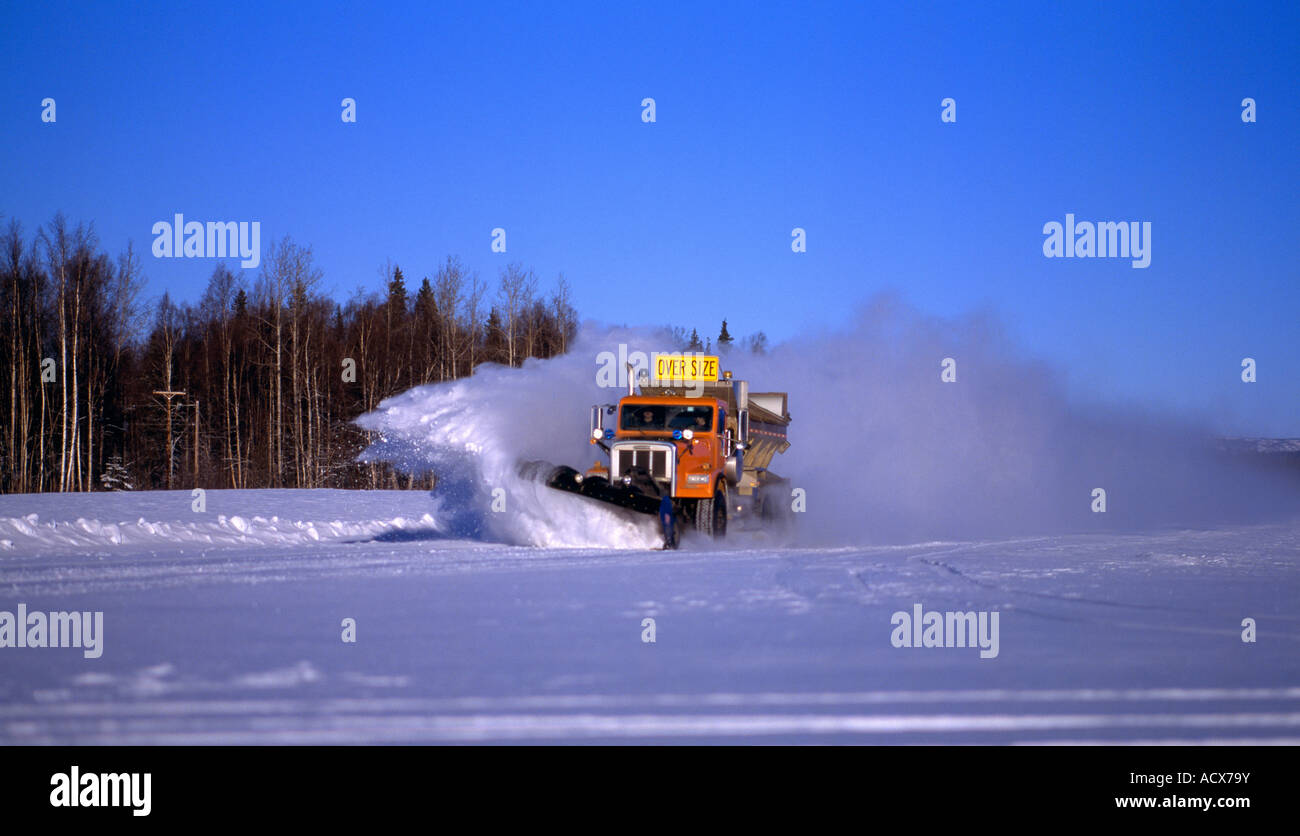A snow plow from the Department of Transportation working the Talkeetna