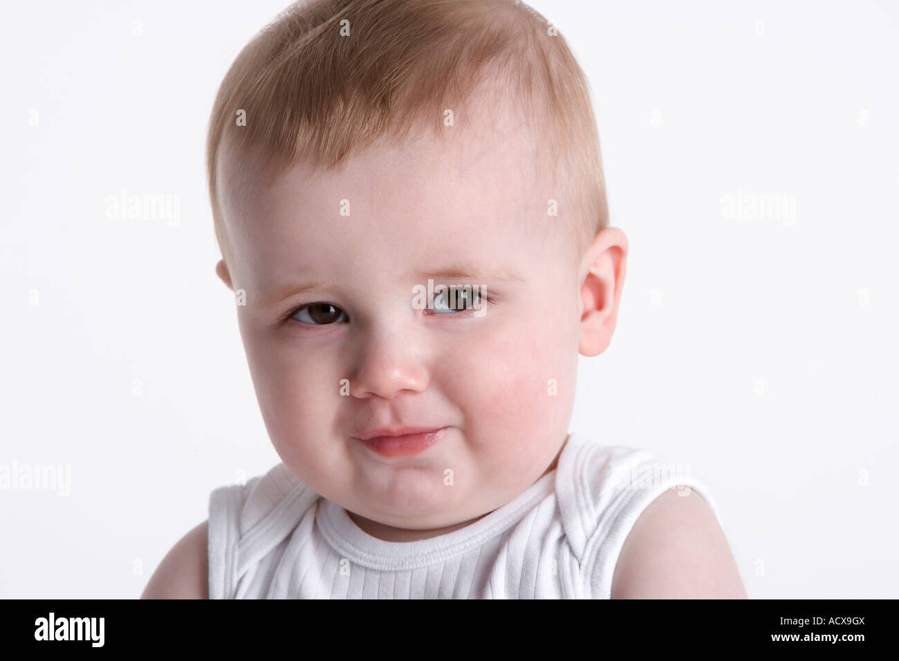 Portrait of a baby boy with a timid expression Stock Photo - Alamy