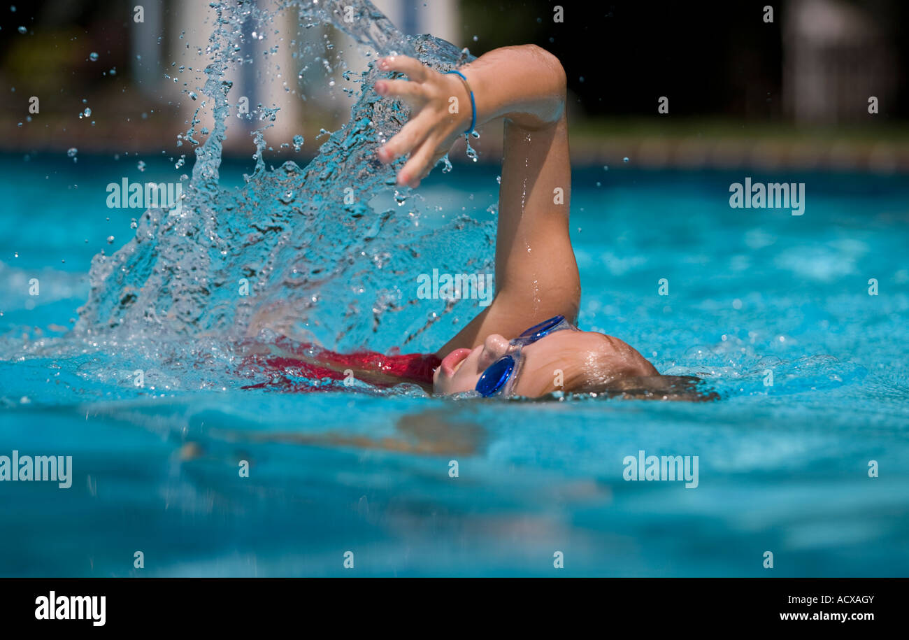 Child swimming freestyle in a pool Stock Photo Alamy