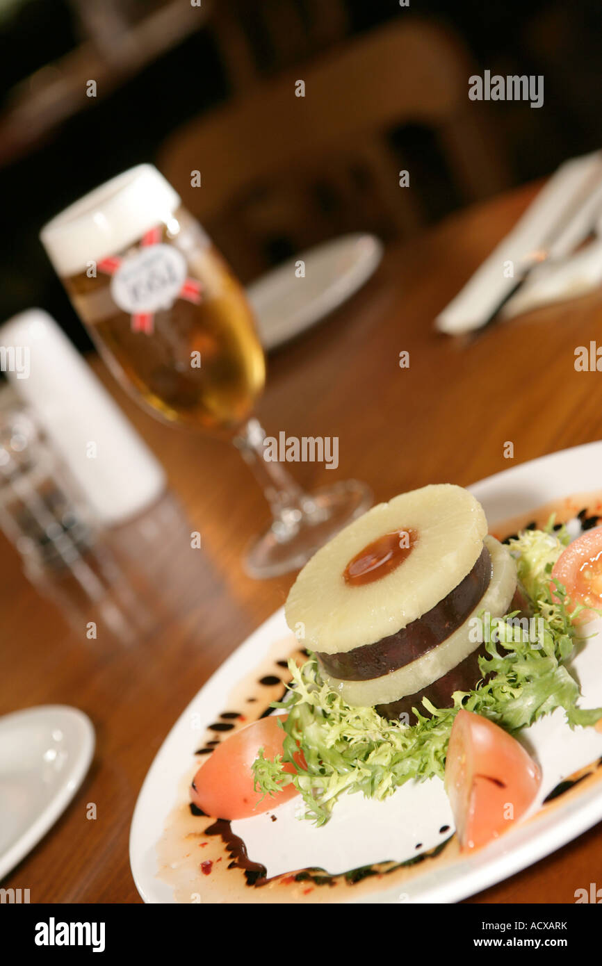 black pudding and pineapple starter Stock Photo