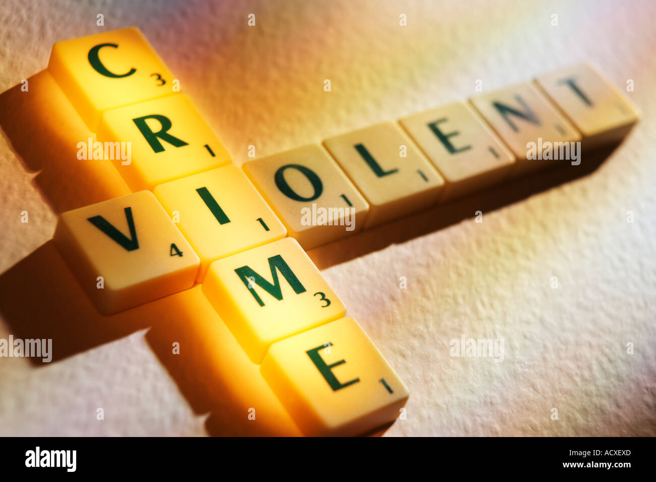 SCRABBLE BOARD GAME LETTERS SPELLING THE WORDS VIOLENT CRIME Stock