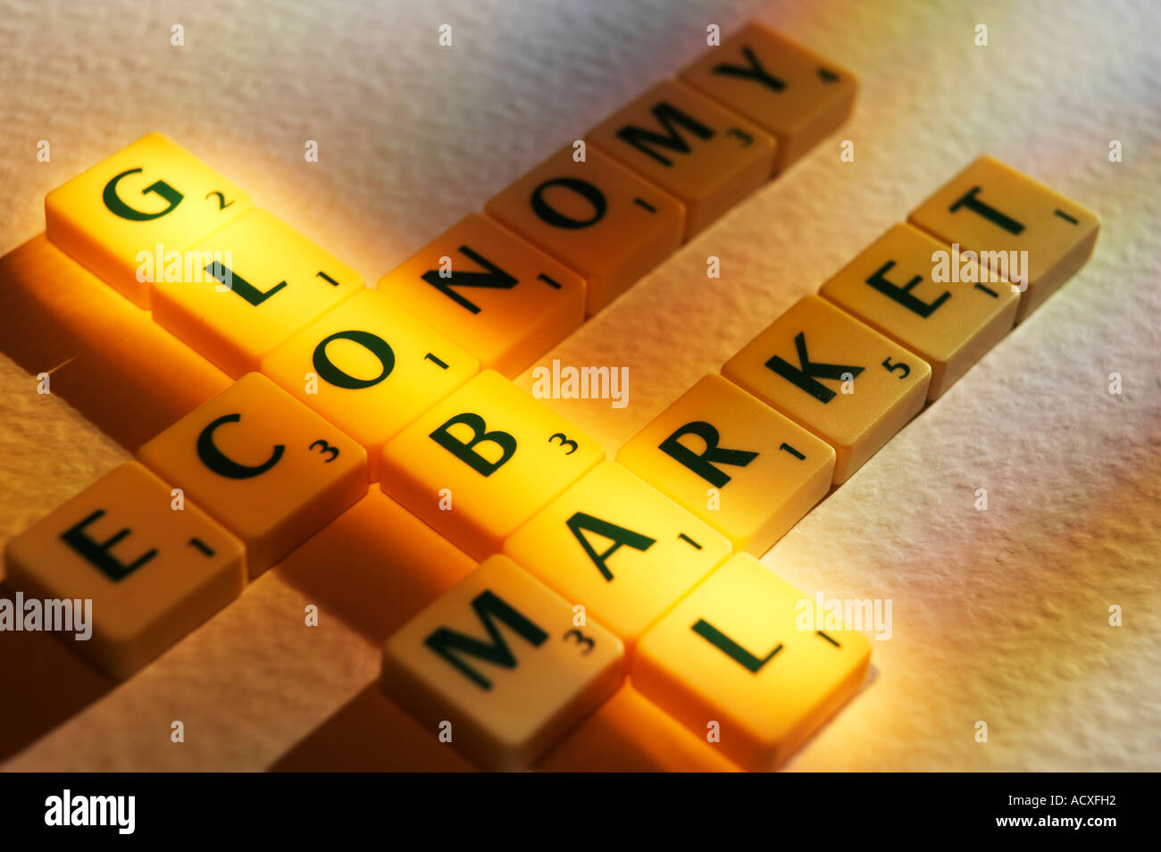 SCRABBLE BOARD GAME LETTERS SPELLING THE WORDS GLOBAL ECONOMY MARKET Stock Photo