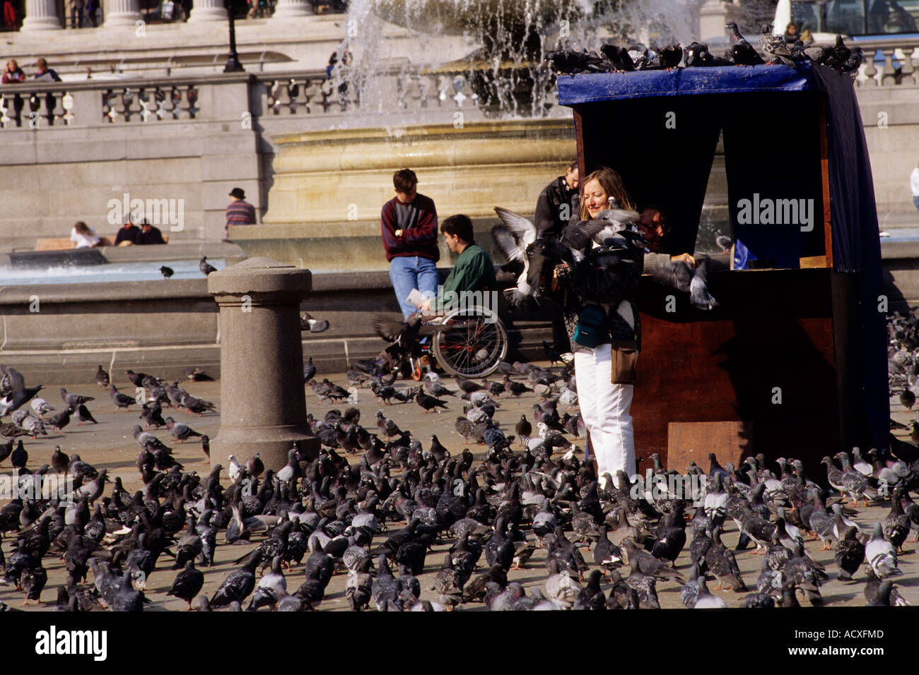 Feeding the pigeons in Trafalgar square in the early 1990's Historic image. Stock Photo