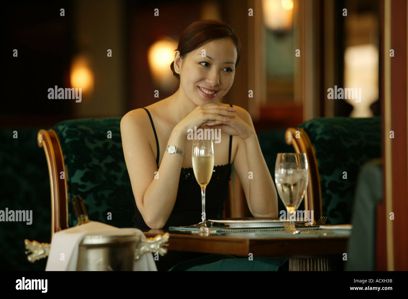 A Chinese woman sitting in a bar Stock Photo